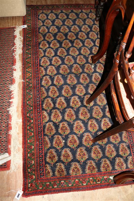 Patterned blue, green & red rug(-)